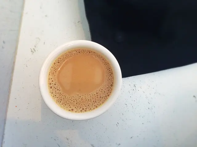 Woman concocts Matcha tea, a renowned morning beverage offering sustained energy and improved...